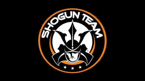 Shogun Team logo featuring a stylized samurai warrior head with orange and white circular design on black background